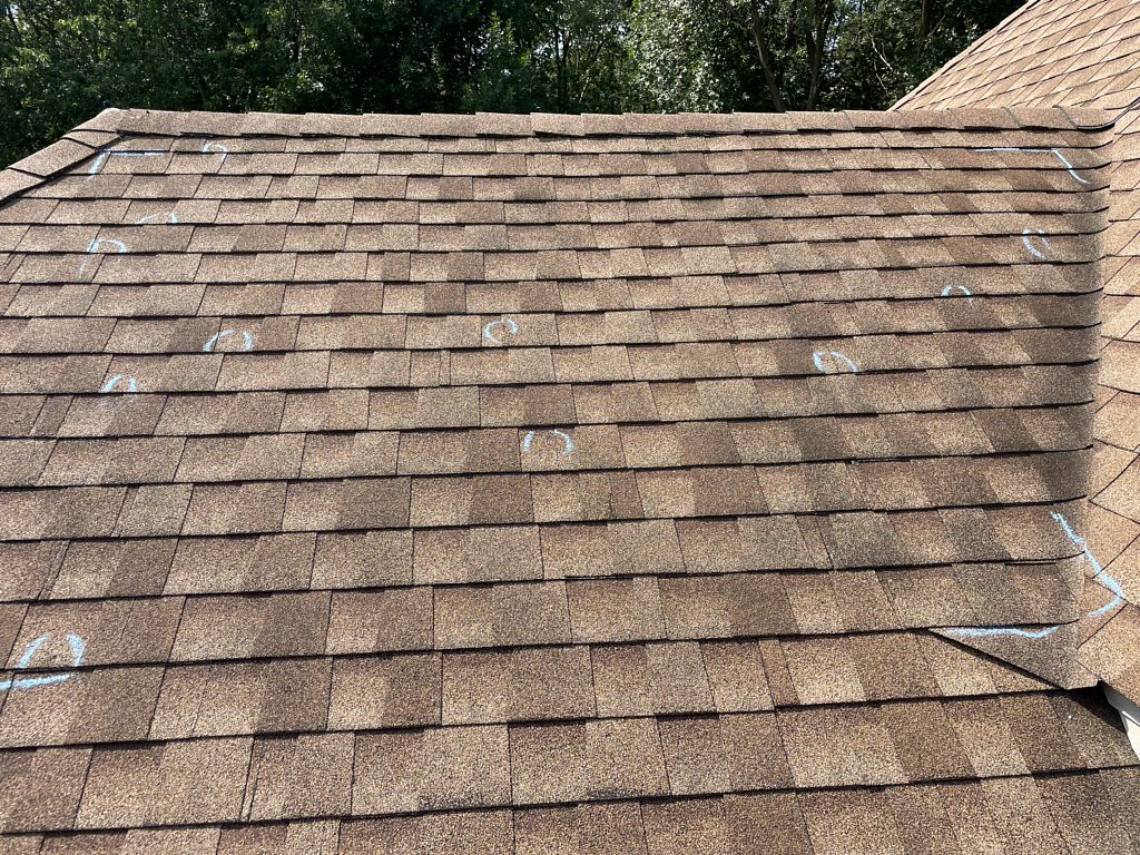 Visualize hail damage on a roof Hail-damaged roof